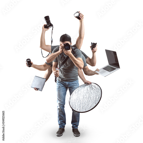 Funny photographer with a lot of equipment isolated on white photo