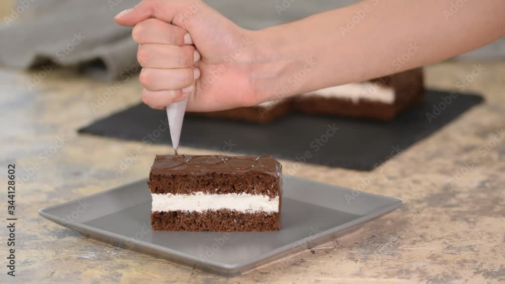 Decorate the cake with chocolate. Preparation of desserts in the kitchen, production of confectionery at home. Decorate the cake with chocolate. Preparation of desserts in the kitchen, production of confectionery at home.