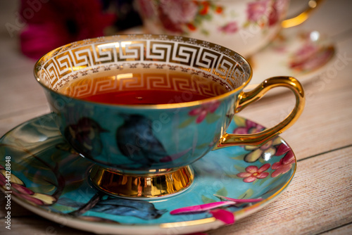 Blue porcelain teacup with black tea