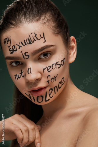 Modern Art activity about civilized society without social barriers due to racial and sexual bias. A brunette lady has a phrase on her face 