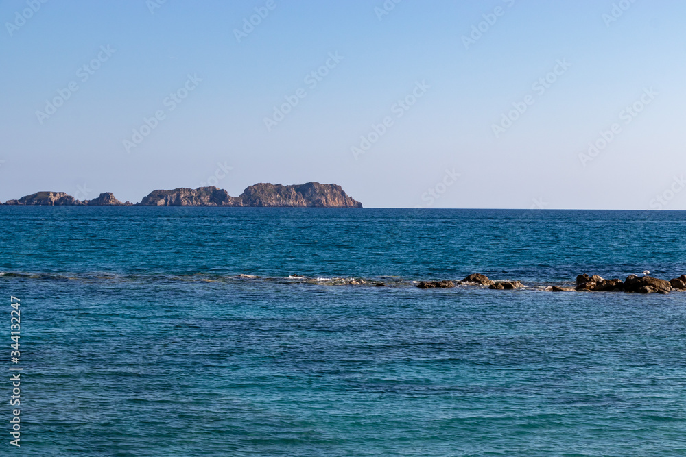 Rocks, cliffs, island and sea water during sunset from the view point cap andritxol in Camp de Mar, Majorca island, Spain