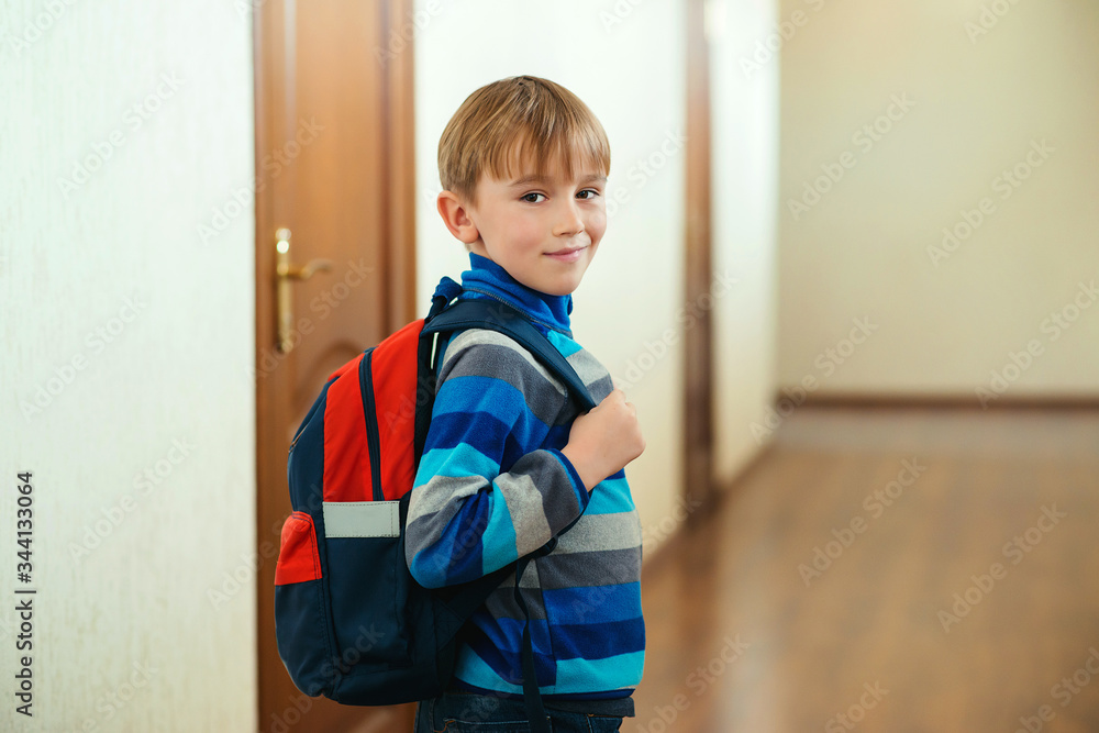 Happy schoolboy with backpack going to class. Back to school. Pupil go to study with backpack. Happy schoolboy with backpack going to class. Back to school. Pupil go to study with backpack.