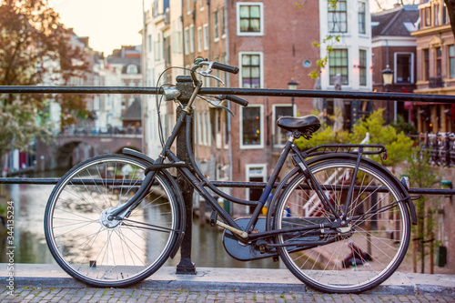 Bicycle in the center of Utrecht in the Netherlands with canals in the background