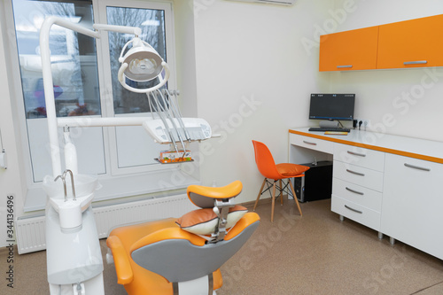 Interior stylish modern dentist office in orange style. © Kate