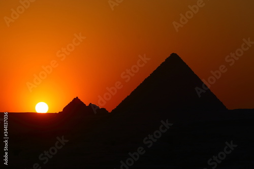Sunset in Pyramid of Menkaure and Queens Pyramids at Giza Plateau
