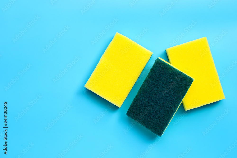 Scrub sponges on blue background. Copy space Scrub sponges on blue background. Copy space
