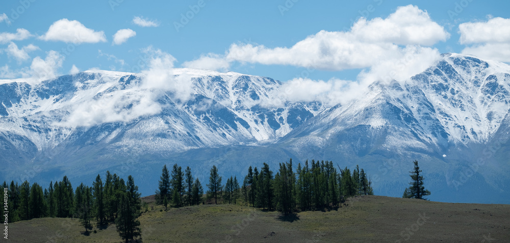 Panorama of the snow caped mountains in Altai Republic, Russia