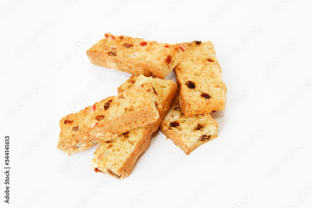 white bread crackers with fruit slices on a white background