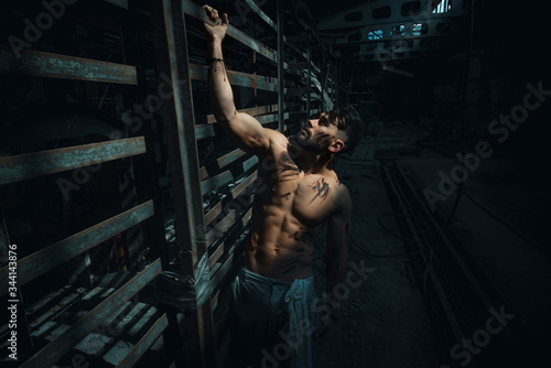 man resting after hard physical work, pumped up athletic body, nice caucasian man, bearded guy.