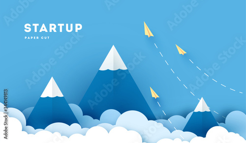 Paper plane flying over mountains between clouds. Modern polygonal shapes background, low poly. Business concept design. Eps10 vector illustration.