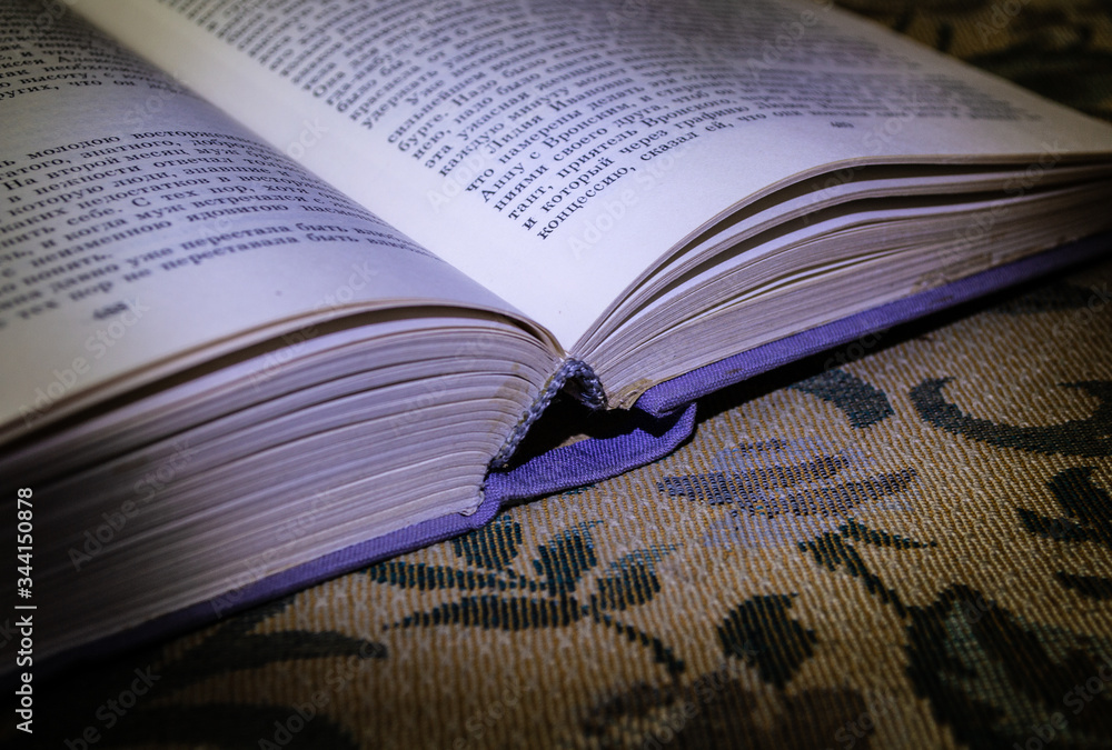 Fototapeta premium old book on a wooden table