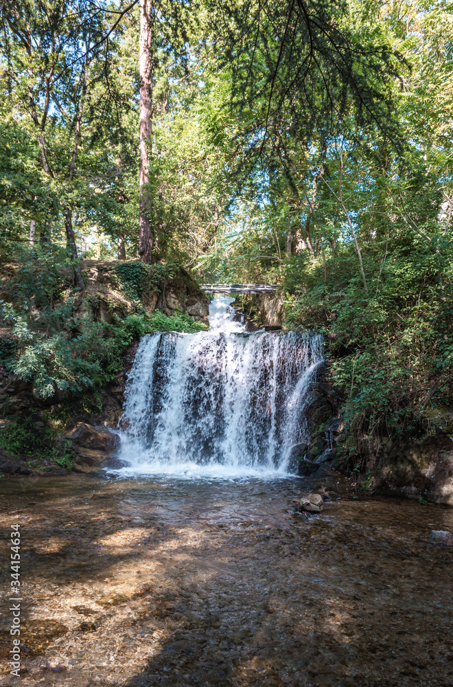 Small waterfall fed by the lake of Saint-Ferreol in South West France Small waterfall fed by the lake of Saint-Ferreol in South West France