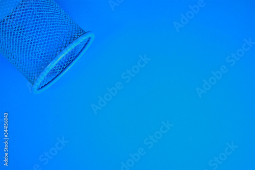 Blue background with metal cylindrical pen, space for text