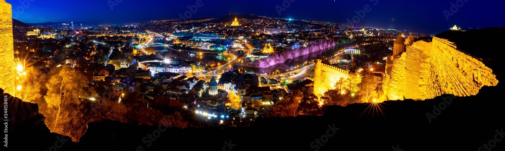 wide angle background image of tbilisi panorama from Narikala fortress at night.Historical sites in Georgia. Blank space. 2020 wide angle background image of tbilisi panorama from Narikala fortress at night.Historical sites in Georgia. Blank space. 2020