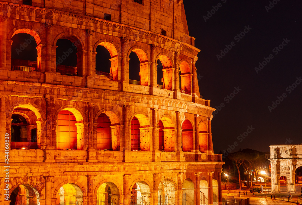Colorful view of the Colosseum at night, Rome  Italy.
