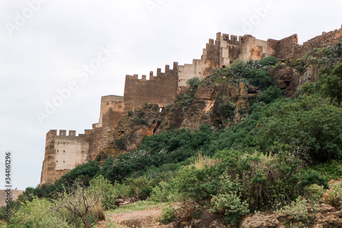 powerful fortifications on the rock of medieval castle of Sagunto, Spain © Sergei Timofeev