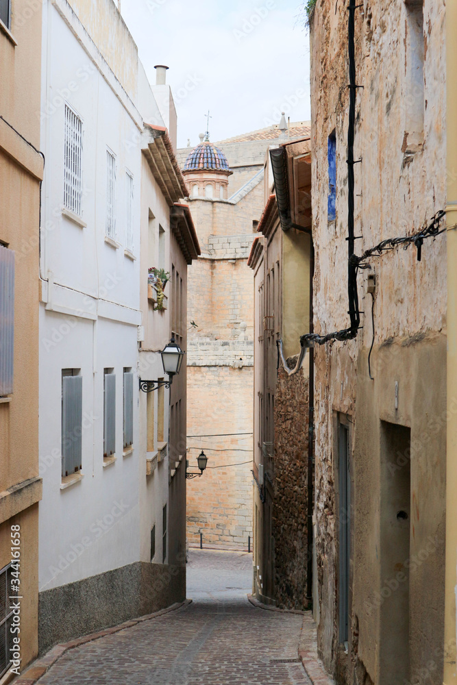 on the empty cosy narrow street in the medieval old town of sagunto, Spain