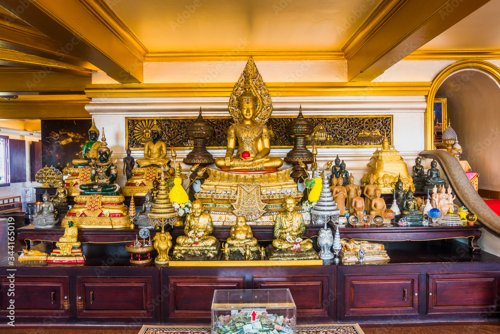Golded Buddha Statue Inside Wat Saket Temple. Beautiful Decorated Altar at the Golden Mount. Wat Saket Temple is a Popular Tourist Attraction in Pom Prap Sattru Phai District, Bangkok, Thailand, Asia.