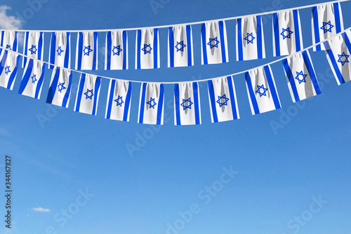 Photos Israel flag festive bunting hanging against a blue sky. 3D Render