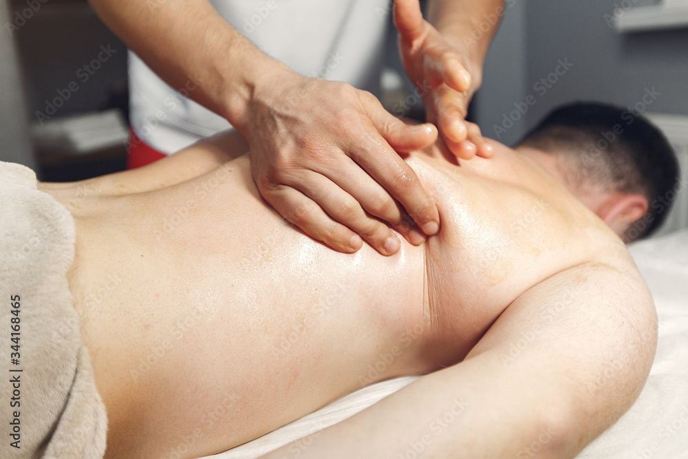 Massage doctor. The man is undergoing rehabilitation Massage doctor. The man is undergoing rehabilitation