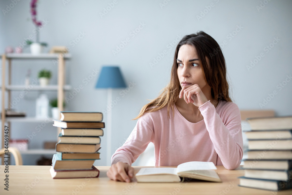 Sad young student preparing for exams. Sad young student preparing for exams.