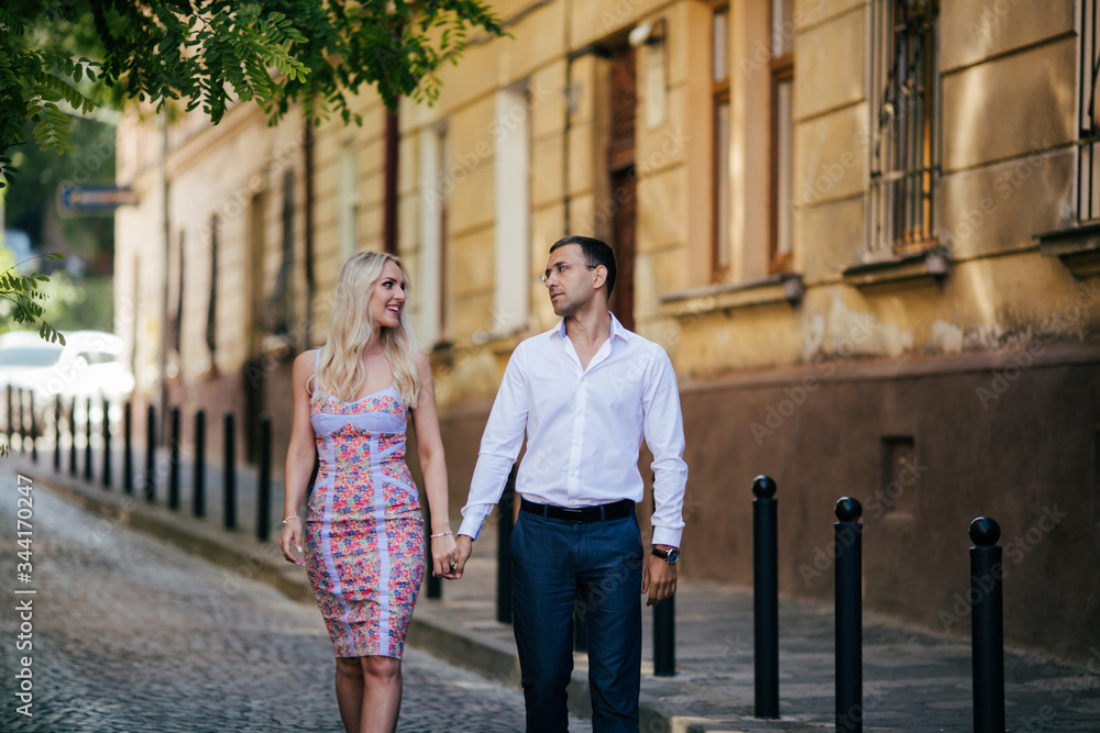 Smiling couple in love outdoors, lviv. summer