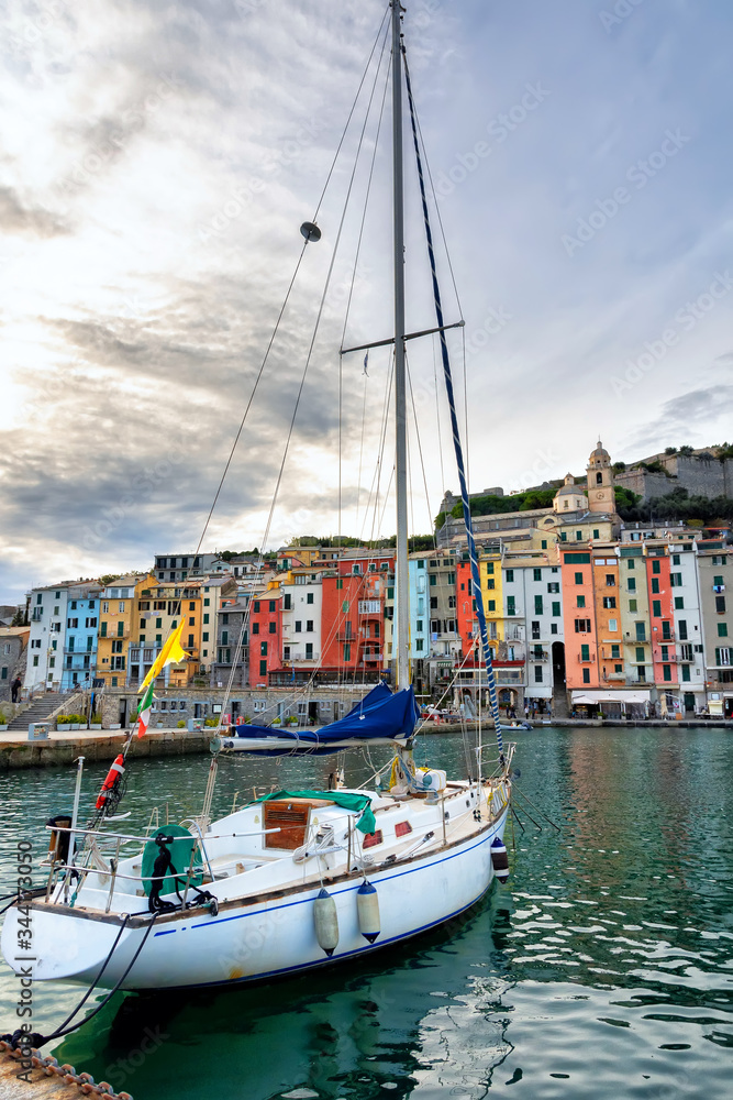 
Panorama of the middle-aged town of Portovenere. Colorful houses in Italian style. Harbor with fishing boats and yachts. Sea coast in Cinque Terre.