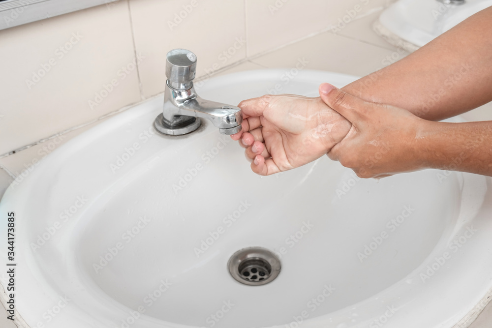Woman's hands wash their hands with soap cleanse the hands in the tub with soap, personal hygiene Woman's hands wash their hands with soap cleanse the hands in the tub with soap, personal hygiene