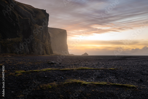 Slika na platnu Scenic cliffs at Vik i Myrdal during sunrise on a foggy day - no