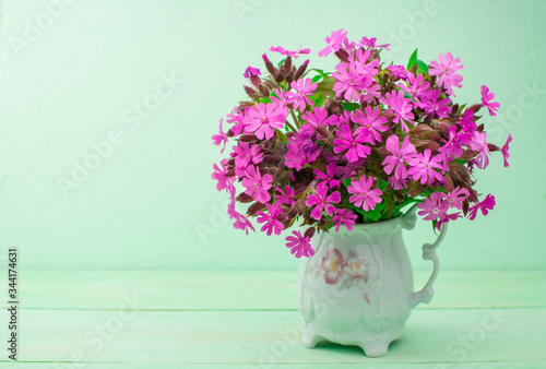 bouquet of pink peonies in a vase photo