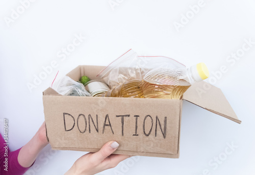 Картината върху платно Volunteer holding food donation box
