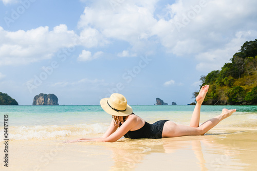 Beautiful woman lies on paradise island beach © o_lypa