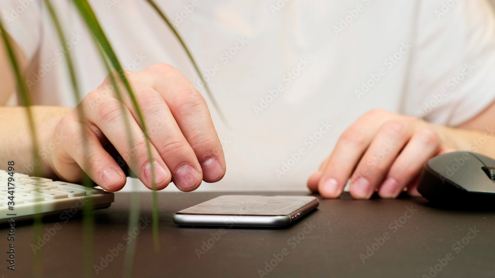 Man using his smartphone. Social network. Close up.