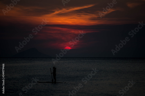 silhouette of a man on the beach at sunset