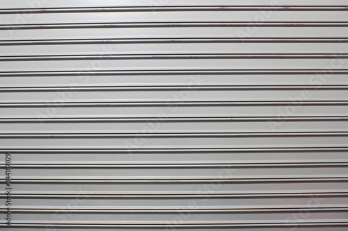 A grey rolled up steel door