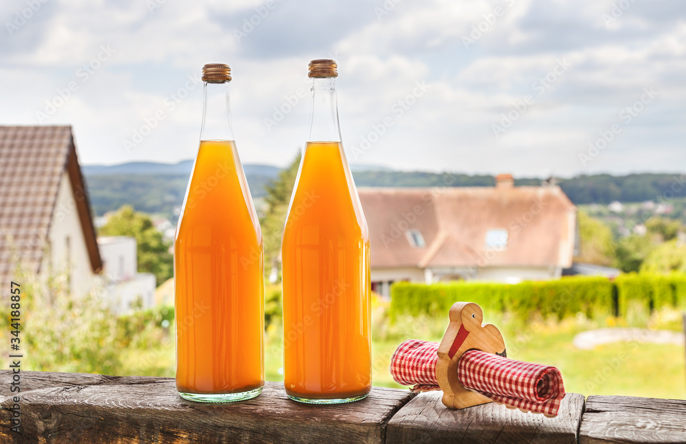 Two bottles of natural apple juice Two bottles of natural apple juice