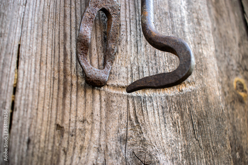 iron latch on the background of a wooden building