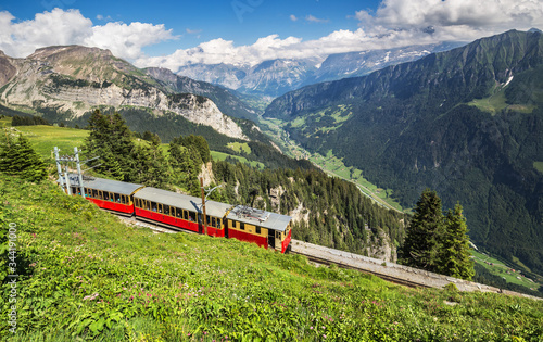 Retro passenger train moves from Schynige Platte to Interlaken. Switzerland