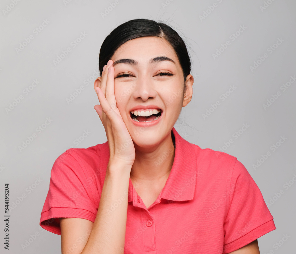 young beautiful asian woman wore pink t shirt, Showed shy expression ,awestruck on gray background young beautiful asian woman wore pink t shirt, Showed shy expression ,awestruck on gray background