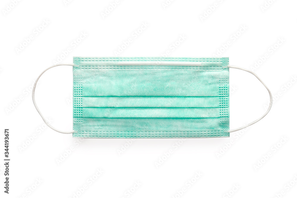 Green medical surgery mask on white background, face protective mask isolated, clipping path included Green medical surgery mask on white background, face protective mask isolated, clipping path included