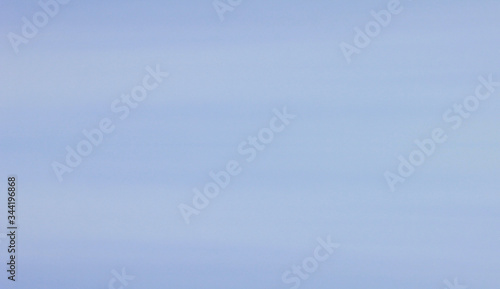 Pale blue sky texture background. Cloudy bluish sky colour texture, cloudscape wallpaper design, empty air and atmosphere concept backdrop