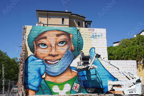 Milan April 2020 , mural in the fight against Covid19 Coronavirus. The artist Lapo Fatai: 