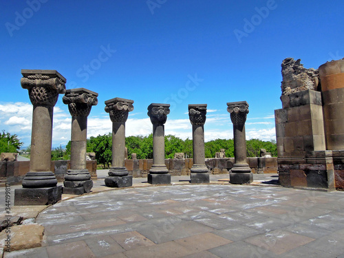 Colonnade of ruined ancient christian Armenian temple Zvartnots, Vagharshapat, Armenia. Built in 650s AD, temple was collapsed after earthquake in 10 century. Now it's became important tourist sight photo