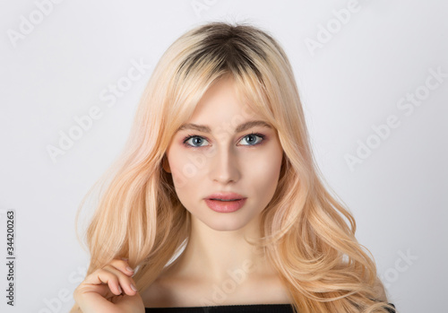 Close up portrait of a beautiful blonde girl with nice face.