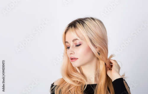 Portrait of a nice and cute blonde model with natural and soft makeup.