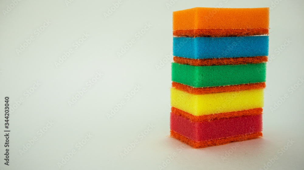 multi-colored dish washing sponges on a white background multi-colored dish washing sponges on a white background