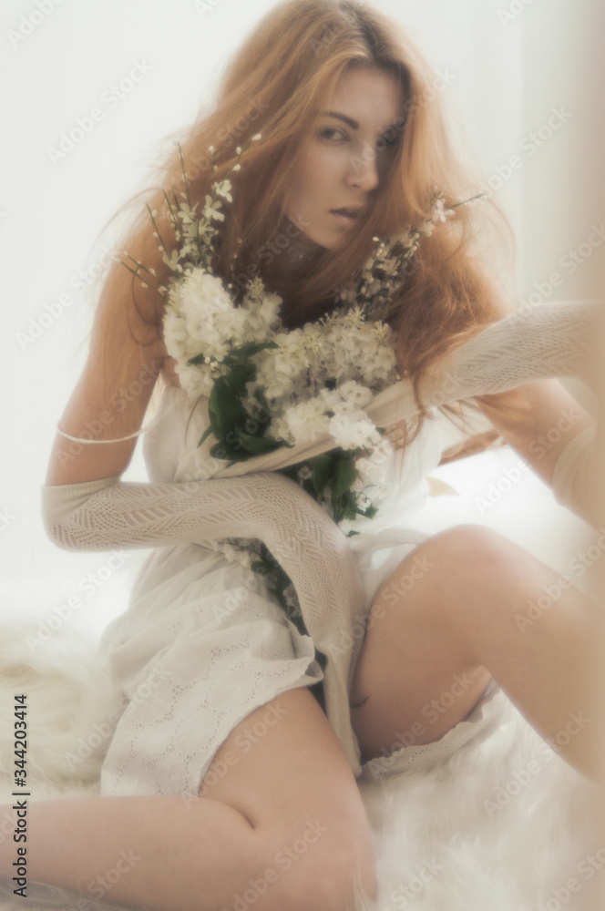 Tender blonde with a bouquet in her hands Tender blonde with a bouquet in her hands