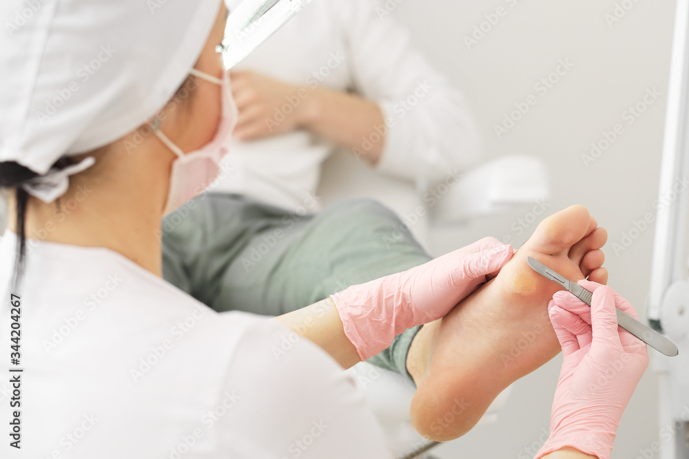 Medical pedicure procedure using special instrument with blade knife