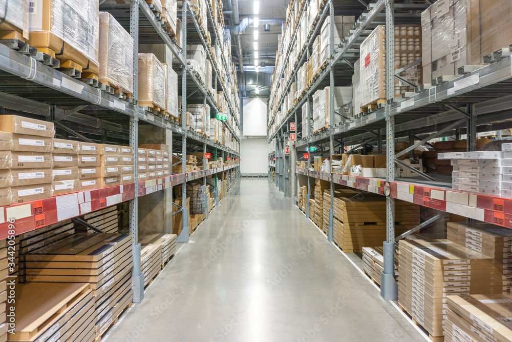 Rows of shelves with boxes in modern warehouse. Warehouse Goods Stock Concept.