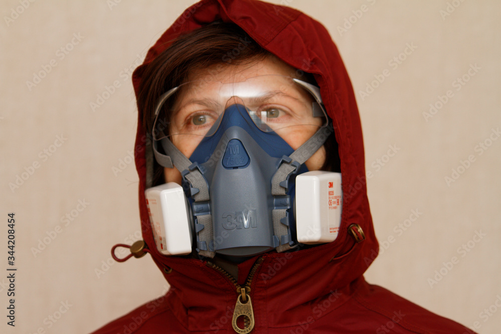 The girl in a protective mask from a coronavirus COVID-19 The girl in a protective mask from a coronavirus COVID-19